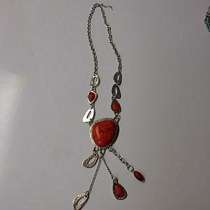 Red stone and silver tone necklace.